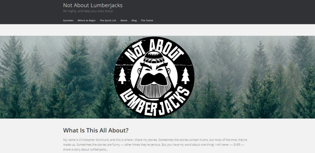 The Not About Lumberjacks homepage. Along the top: "Not About Lumberjacks" and menu options for the site.

Mid-page: The Not About Lumberjacks logo against a strip of forest (photo).

Bottom: "What is this all about?" and website description.