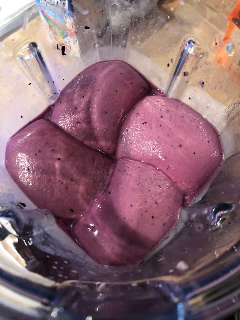 Bananas, blueberries, and almost milk whirring in a Vitamix.